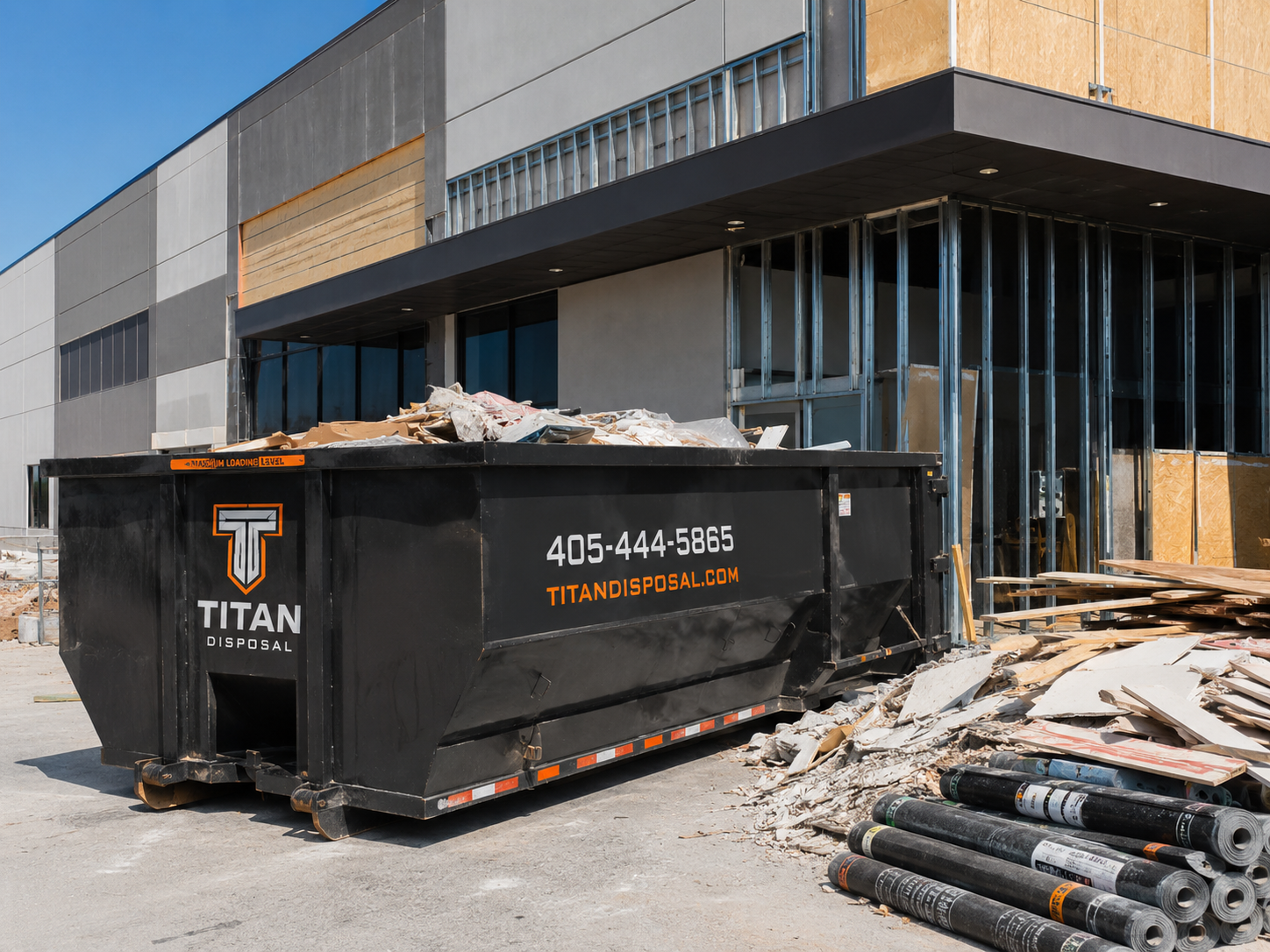 Commercial construction roll-off dumpster rental on an active job site